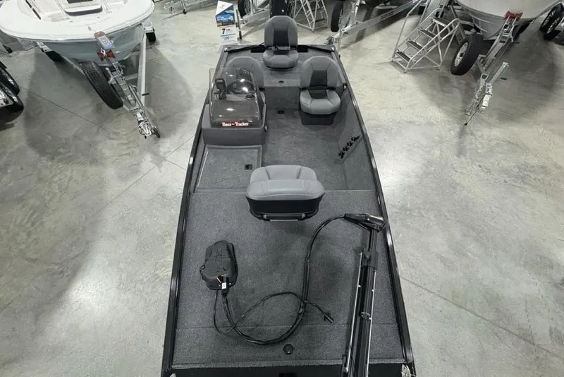 Slide: The Image of 2025 Tracker BASS TRACKER® Classic XL boat interior with seating and equipment in showroom. - 29
