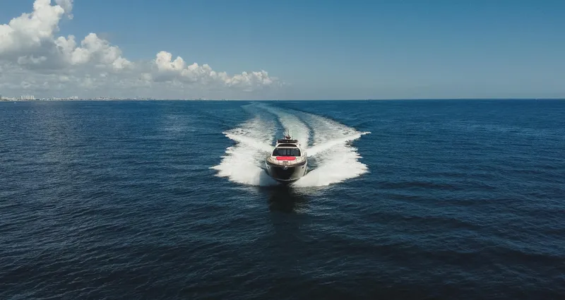 Slide: The Image of 2011 Riva SportRiva 56 yacht cruising on open sea under clear blue sky. - 10
