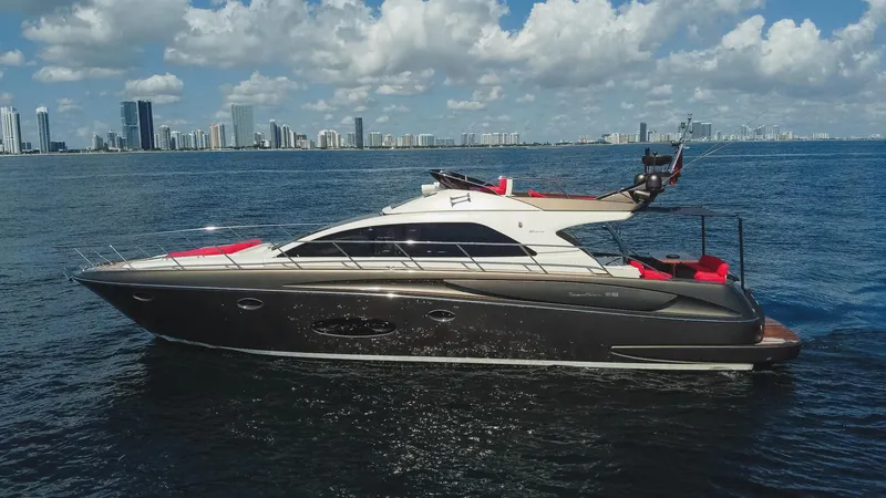 Slide: The Image of Luxurious 2011 Riva SportRiva 56 yacht cruising on a sunny day with city skyline backdrop. - 11