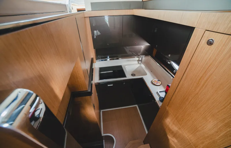 Slide: The Image of 2011 Riva SportRiva 56 yacht kitchen with modern wood cabinetry and sleek design. - 17