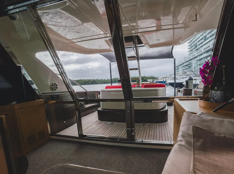 Slide: The Image of Luxurious 2011 Riva SportRiva 56 yacht interior with elegant seating and scenic water view. - 19