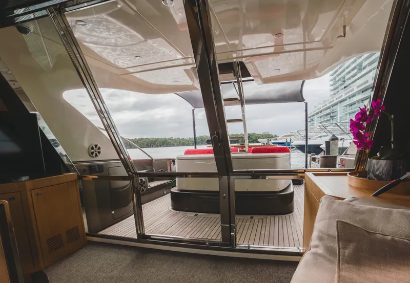 Slide: The Image of Luxurious 2011 Riva SportRiva 56 yacht interior with elegant seating and scenic water views. - 20