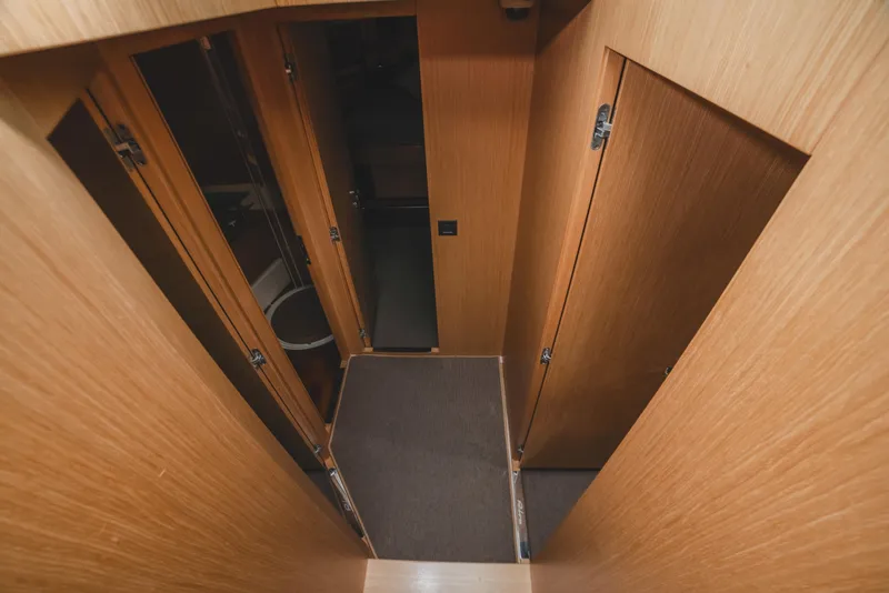 Slide: The Image of Interior hallway of 2011 Riva SportRiva 56 yacht with wooden doors and flooring. - 22