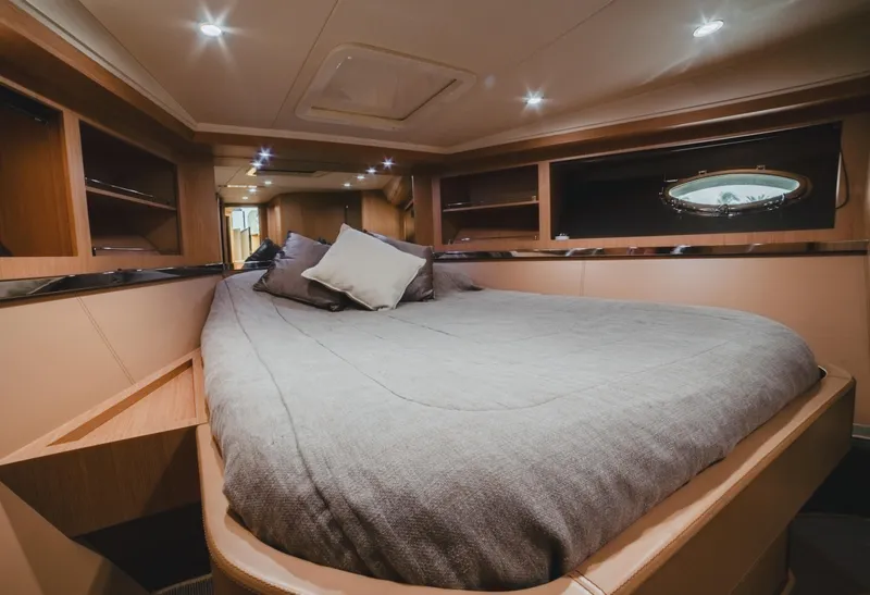 Slide: The Image of Luxurious cabin interior of 2011 Riva SportRiva 56 yacht with cozy bedding. - 24