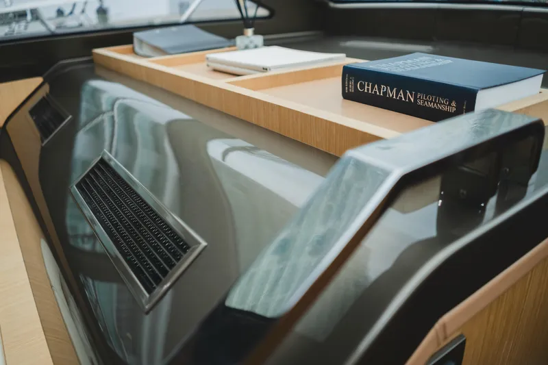 Slide: The Image of 2011 Riva SportRiva 56 yacht interior with books and sleek design. - 29