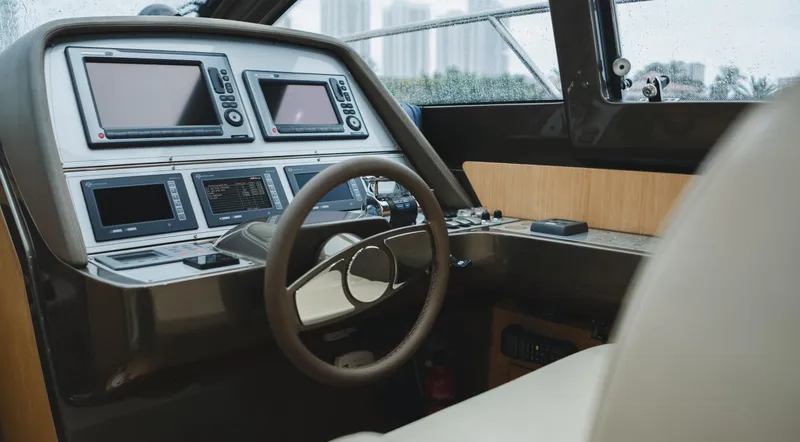 Slide: The Image of Cockpit of 2011 Riva SportRiva 56 yacht with modern navigation equipment and steering wheel. - 31