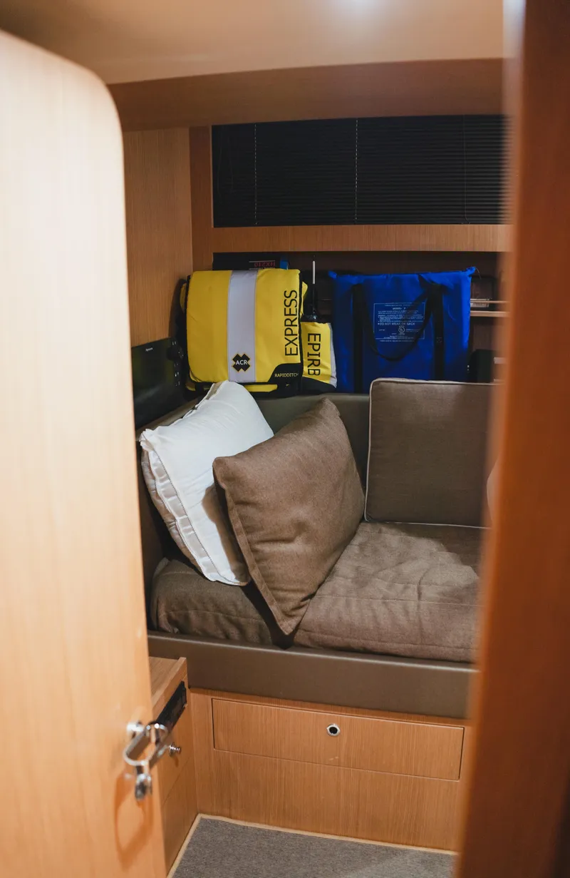 Slide: The Image of Cozy cabin interior of 2011 Riva SportRiva 56 yacht with cushions and bags. - 34