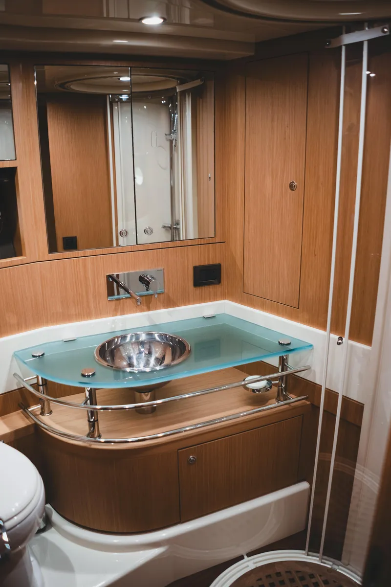 Slide: The Image of Luxurious bathroom in 2011 Riva SportRiva 56 yacht with modern fixtures and wood accents. - 37