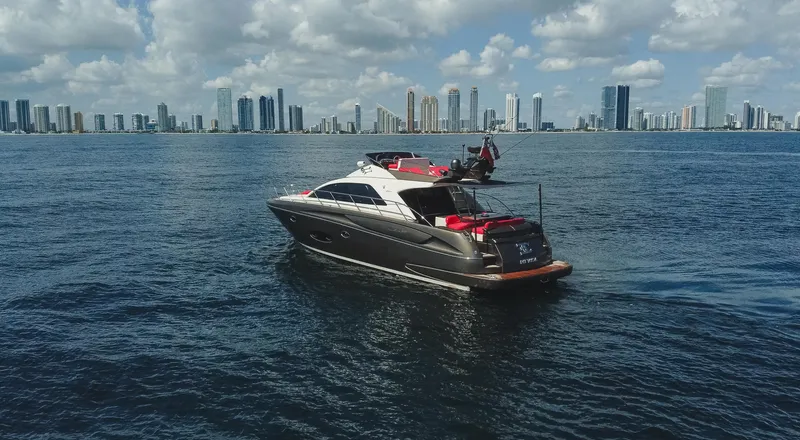 Slide: The Image of 2011 Riva SportRiva 56 yacht on water with city skyline in background. - 4