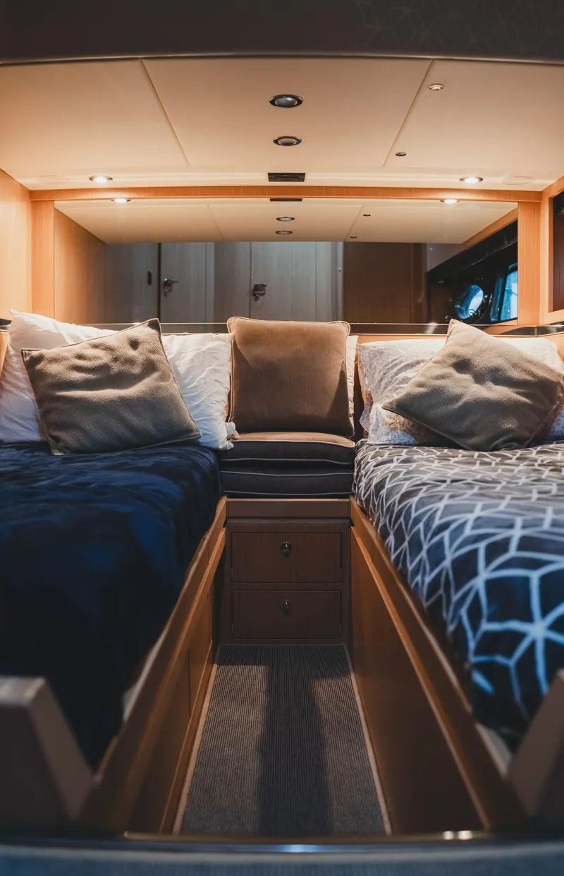 Slide: The Image of Luxurious cabin interior of 2011 Riva SportRiva 56 yacht with twin beds and plush pillows. - 42