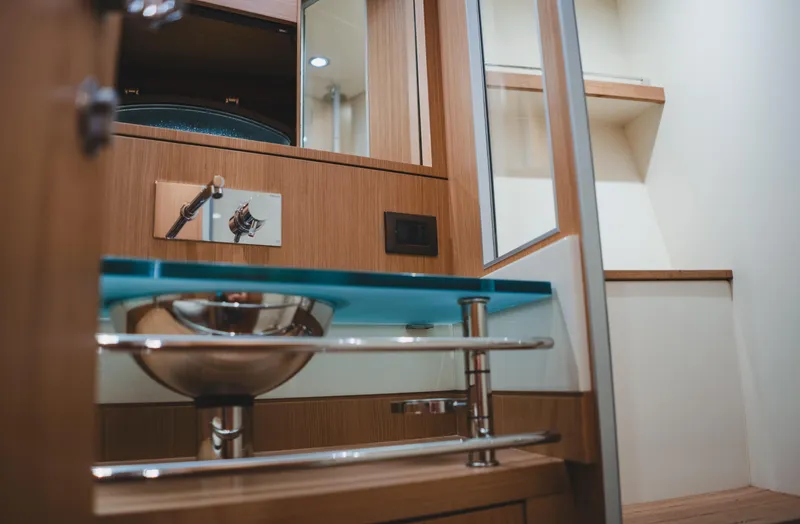 Slide: The Image of Luxurious bathroom interior of 2011 Riva SportRiva 56 yacht with modern sink and wooden accents. - 44