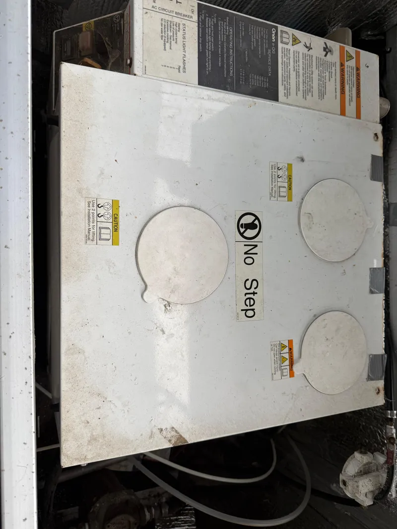 Slide: The Image of Electrical panel with "No Step" warning on a 2001 Myacht M Yacht. - 15