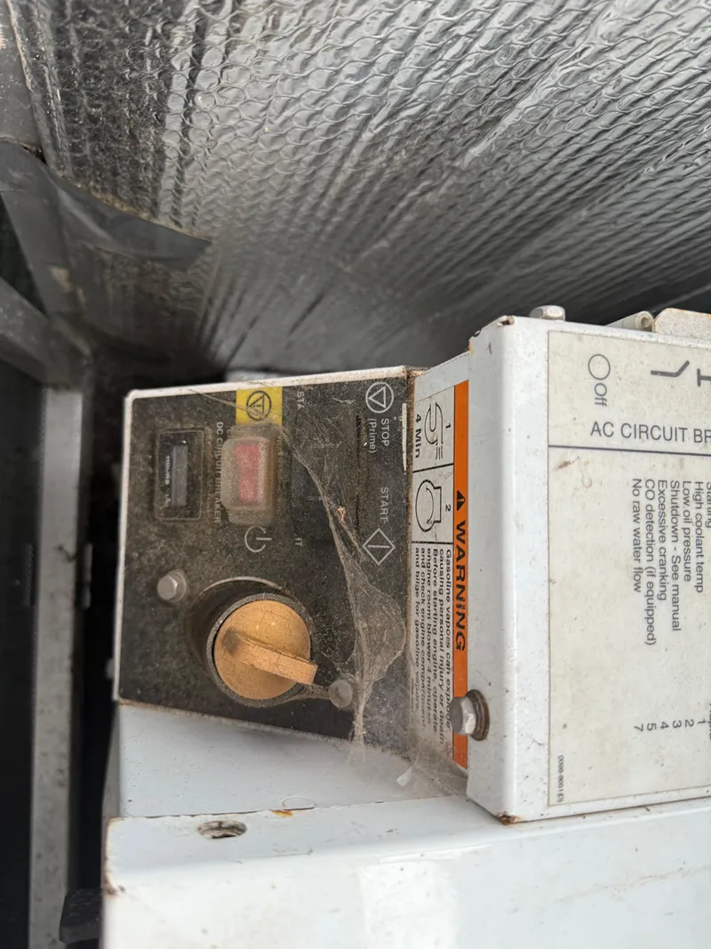 Slide: The Image of Control panel with cobwebs on a 2001 Myacht M Yacht. - 16