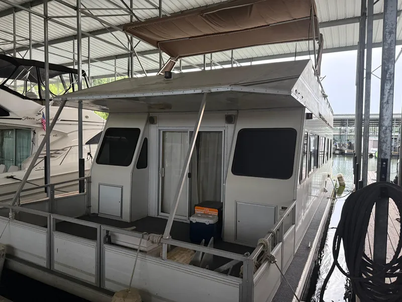 Slide: The Image of 2001 Myacht M Yacht docked in a covered marina. - 2