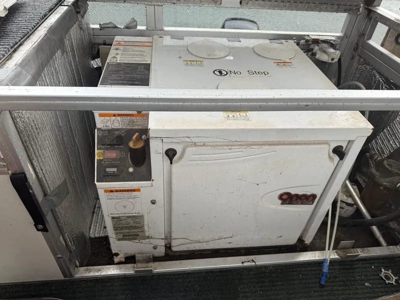 Slide: The Image of 2001 Myacht M Yacht generator compartment with warning labels and "No Step" sign. - 20