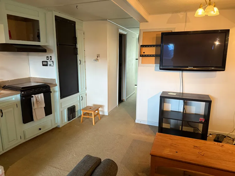 Slide: The Image of Interior of 2001 Myacht M Yacht with TV, kitchen, and seating area. - 22