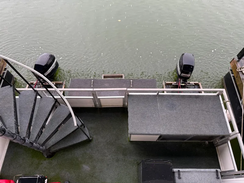 Slide: The Image of 2001 Myacht M Yacht with spiral staircase and dual outboard motors on water. - 25