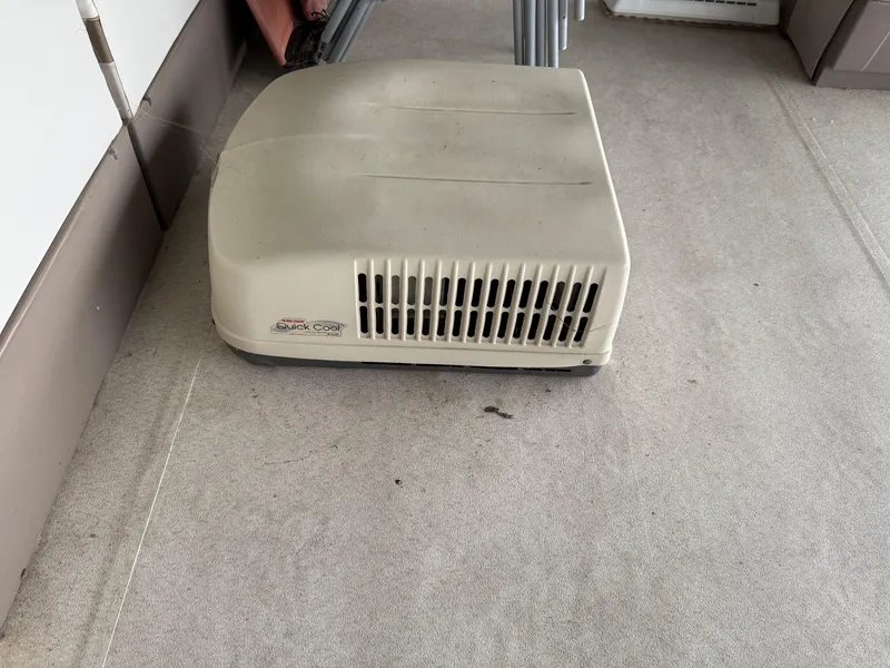 Slide: The Image of Air conditioning unit on a 2001 Myacht M Yacht, beige with vented design. - 27