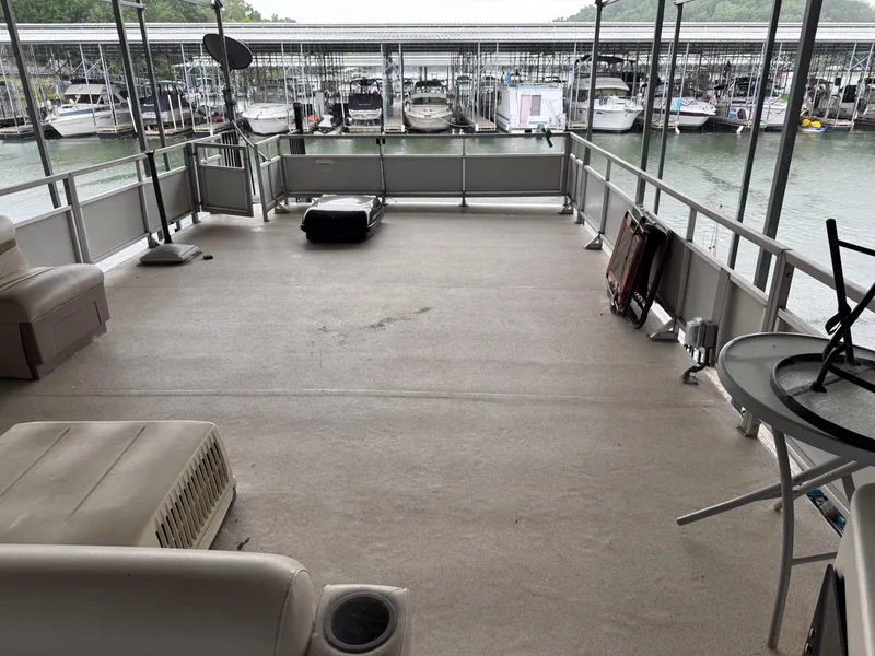 Slide: The Image of Spacious deck of 2001 Myacht M Yacht with marina view. - 29