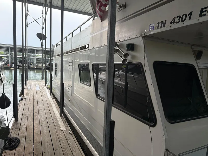 Slide: The Image of 2001 Myacht M Yacht docked at marina, side view with wooden walkway. - 3