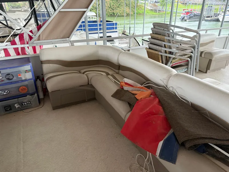 Slide: The Image of 2001 Myacht M Yacht interior with seating, storage, and outdoor view. - 30