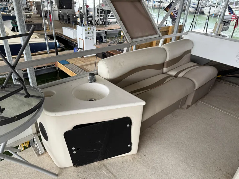 Slide: The Image of 2001 Myacht M Yacht interior with sink and seating area in a marina setting. - 31