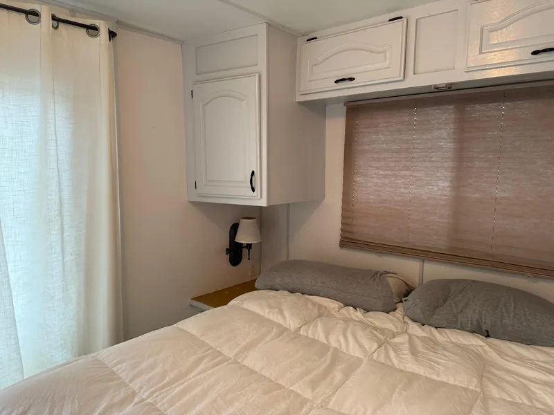 Slide: The Image of Cozy bedroom in 2001 Myacht M Yacht with white cabinets and beige blinds. - 37
