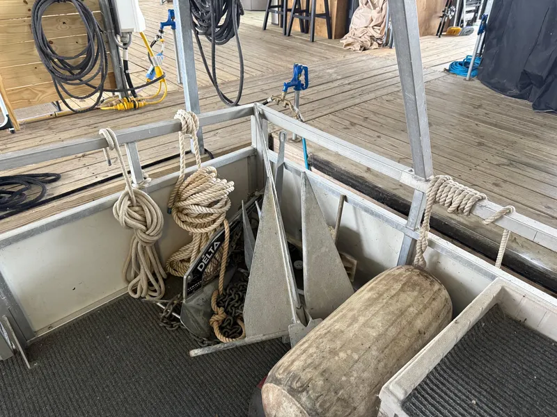 Slide: The Image of 2001 Myacht M Yacht deck with ropes, anchors, and marine equipment. - 39