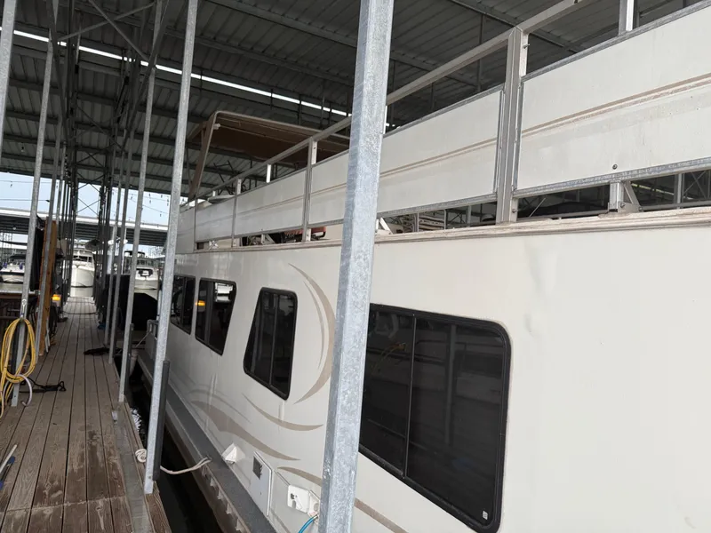 Slide: The Image of 2001 Myacht M Yacht docked in a covered marina, side view. - 4