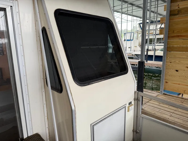 Slide: The Image of 2001 Myacht M Yacht docked, featuring a window and partial exterior view. - 40