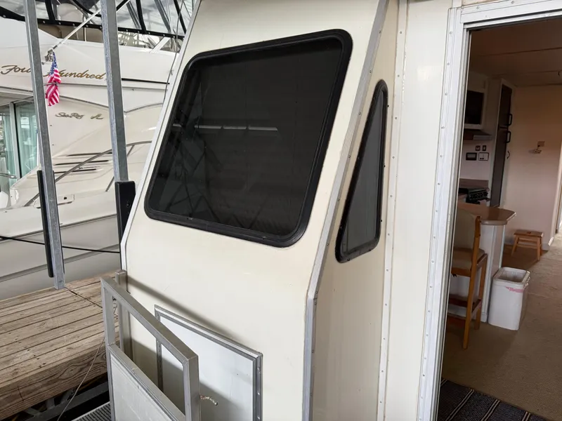 Slide: The Image of 2001 Myacht M Yacht interior view with docked boats in background. - 41