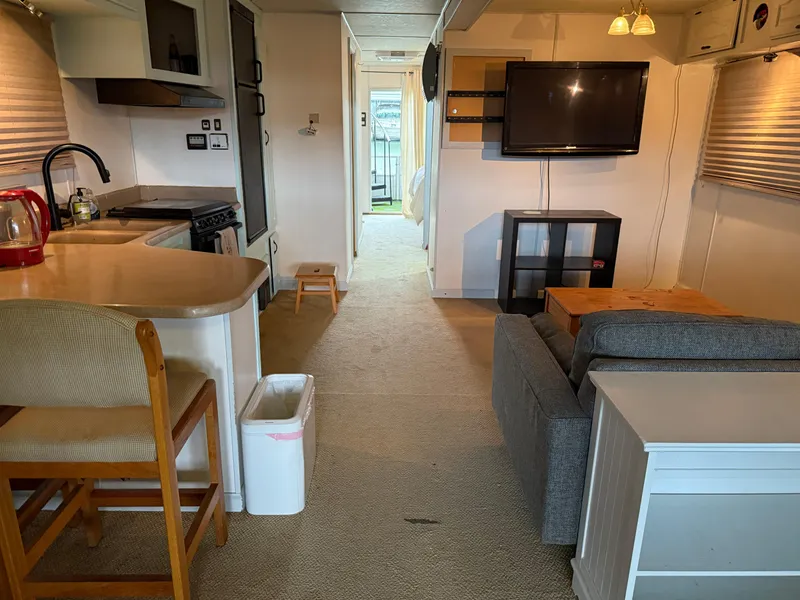 Slide: The Image of Interior of 2001 Myacht M Yacht with kitchen, seating area, and TV. - 42