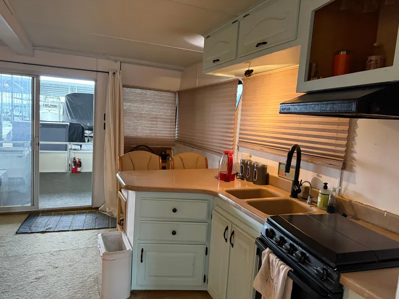 Slide: The Image of Interior of 2001 Myacht M Yacht kitchen with appliances and seating area. - 47