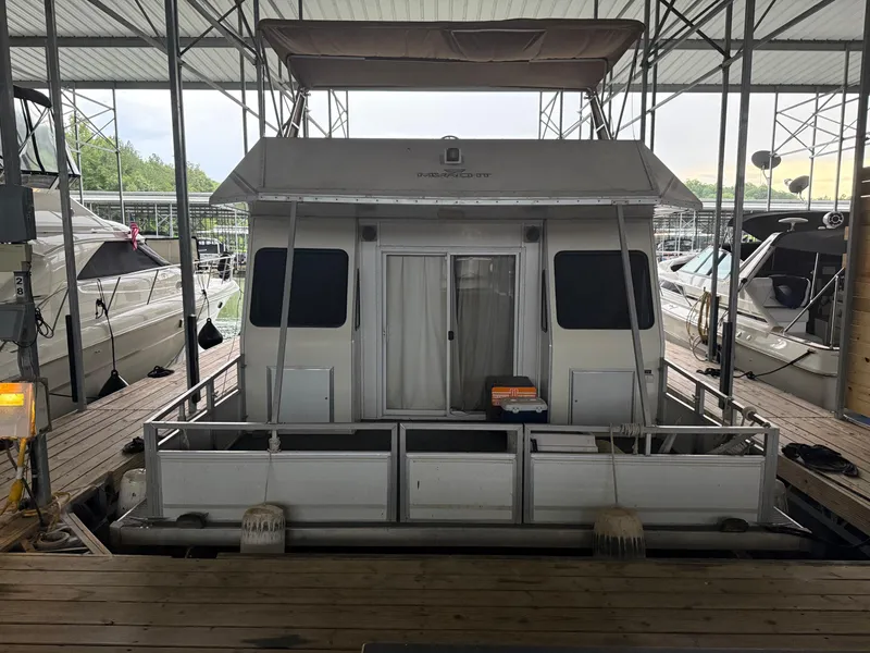 Slide: The Image of 2001 Myacht M Yacht docked in a marina, surrounded by other boats. - 6