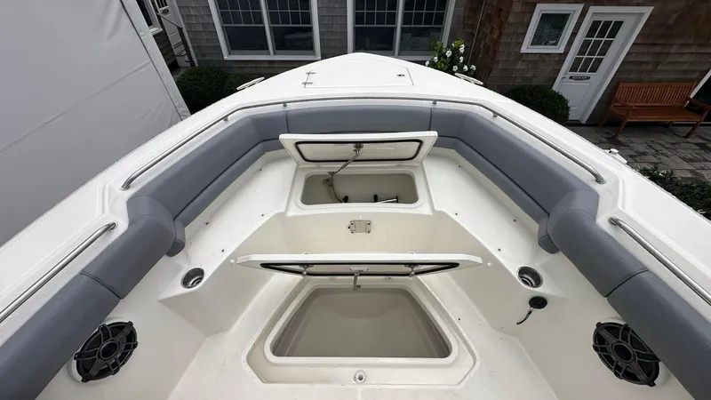 Slide: The Image of 2025 Boston Whaler 330 Outrage boat interior with seating and storage compartments. - 38