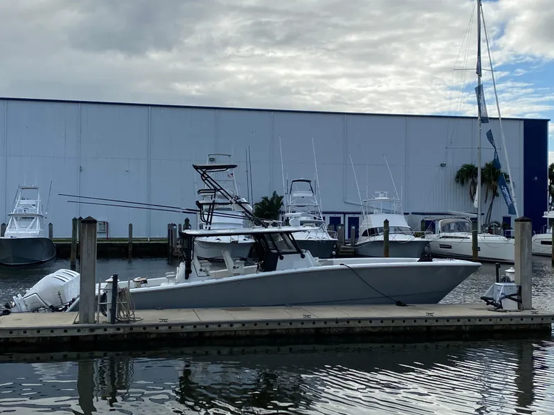 Slide: The Image of 2021 Freeman 42 LR boat docked at marina with overcast sky. - 12