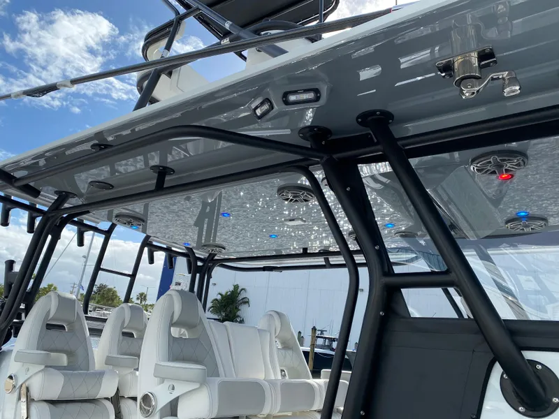 Slide: The Image of 2021 Freeman 42 LR boat interior with white seating and overhead lighting. - 3