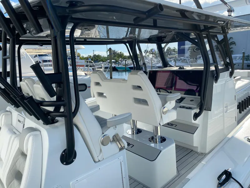 Slide: The Image of Interior view of a 2021 Freeman 42 LR boat with modern seating and controls. - 4
