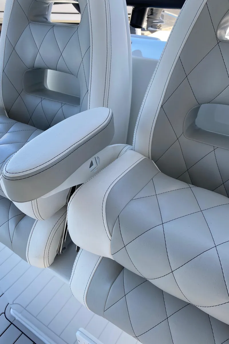 Slide: The Image of Luxurious white leather seats with diamond stitching in a 2021 Freeman 42 LR boat. - 8