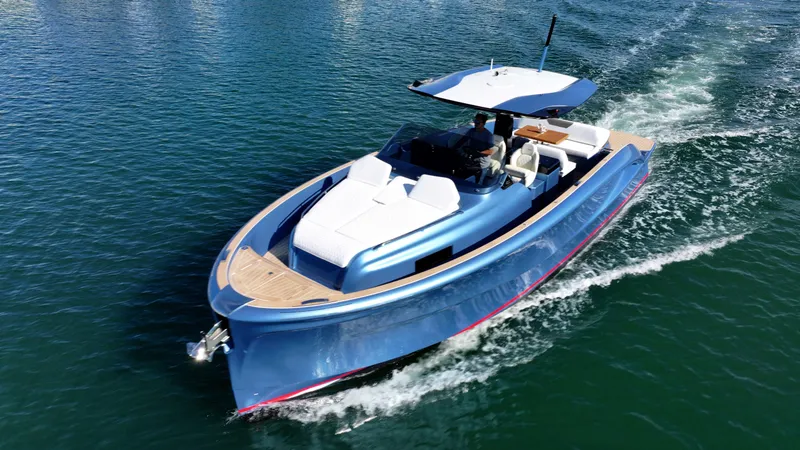 Slide: The Image of 2023 Solaris Power 40 Open yacht cruising on clear blue water. - 0