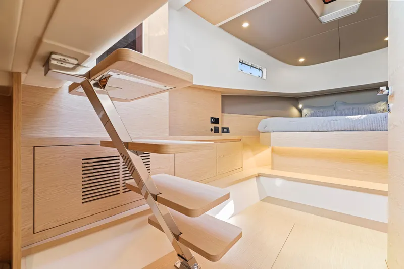 Slide: The Image of 2023 Solaris Power 40 Open yacht interior with modern wooden design and compact staircase. - 31