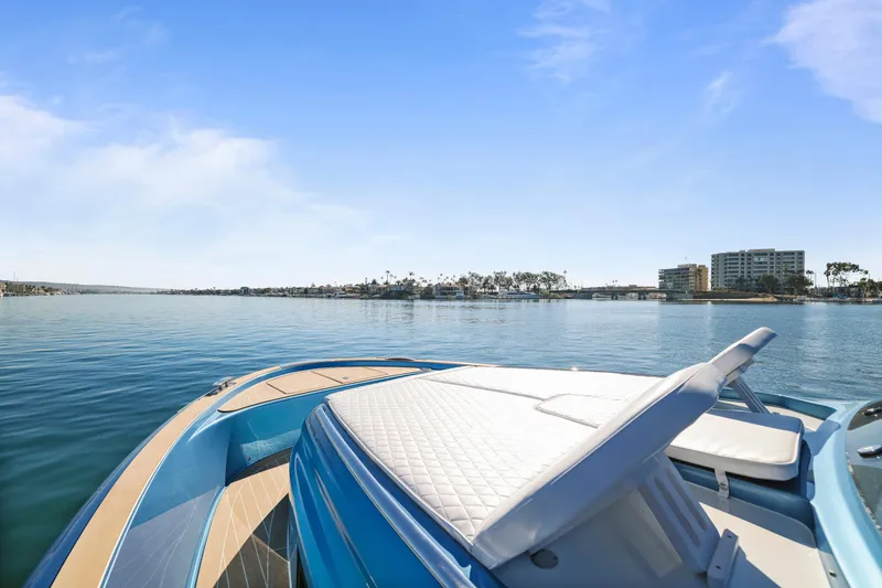 Slide: The Image of 2023 Solaris Power 40 Open yacht on calm water, clear sky, coastal view. - 39