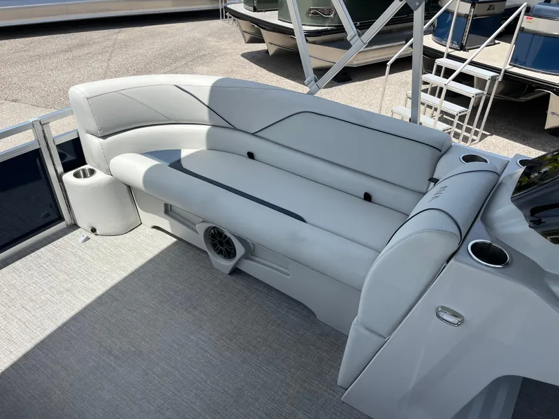 Slide: The Image of 2025 Avalon 2385 Venture 85 Quad Lounger interior with plush seating and cup holders. - 12