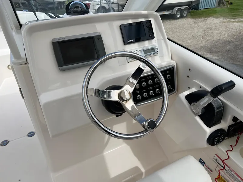 Slide: The Image of Steering console of 2013 Everglades 230 Dual Console boat with navigation equipment. - 10
