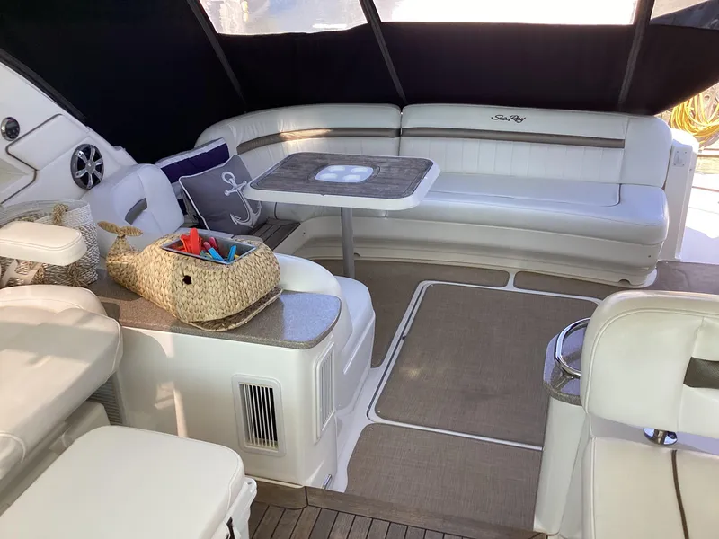 Slide: The Image of Interior of 2006 Sea Ray 48 Sundancer yacht with seating and table. - 10
