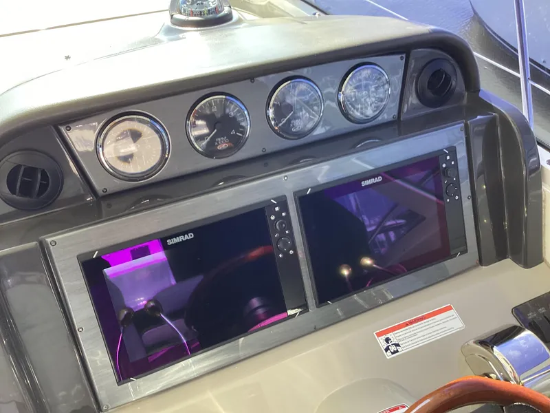 Slide: The Image of Helm of 2006 Sea Ray 48 Sundancer with Simrad displays and gauges. - 11