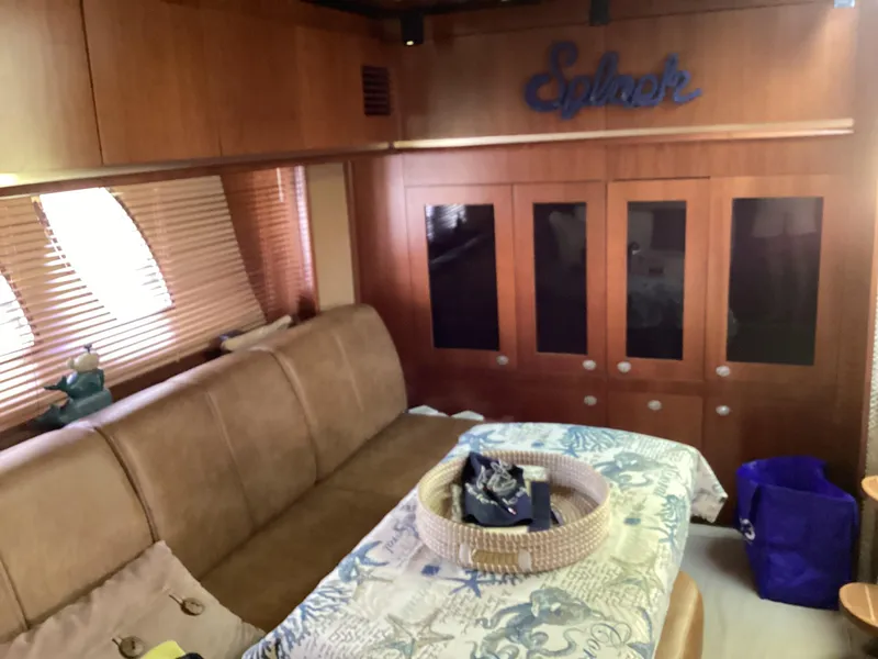 Slide: The Image of Interior of 2006 Sea Ray 48 Sundancer yacht with wooden cabinets and comfortable seating. - 15