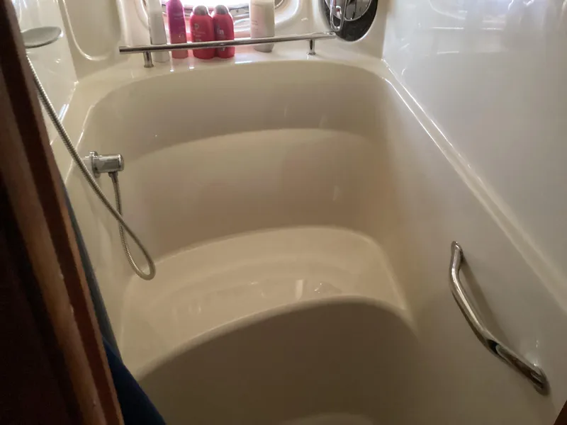 Slide: The Image of Shower area in 2006 Sea Ray 48 Sundancer yacht with toiletries and handrail. - 23