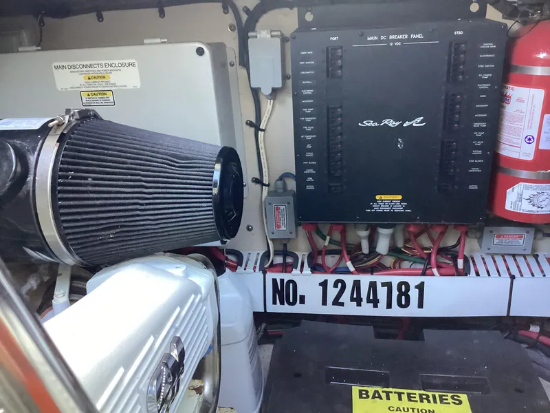 Slide: The Image of Engine room of 2006 Sea Ray 48 Sundancer with electrical panel and fire extinguisher. - 27