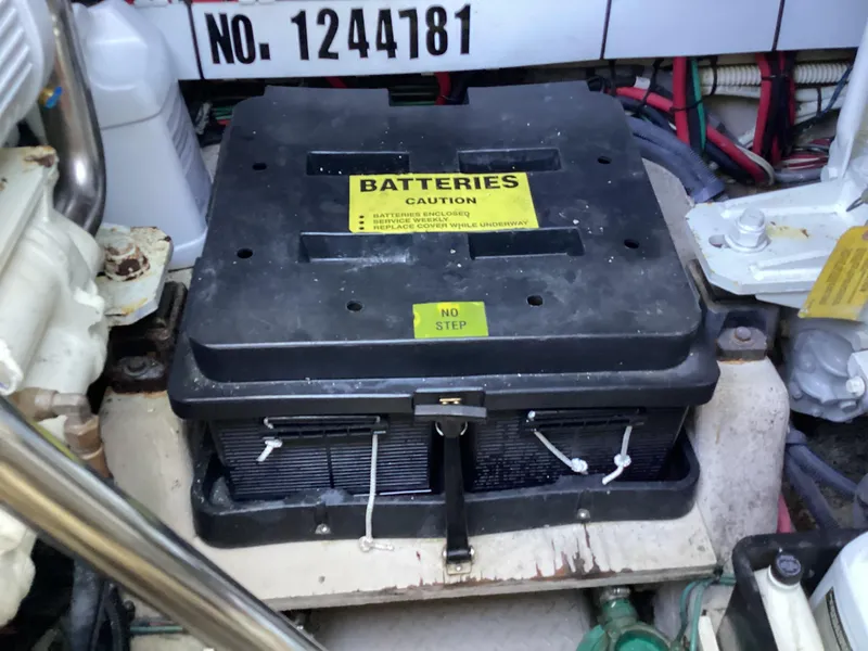 Slide: The Image of Battery compartment in a 2006 Sea Ray 48 Sundancer boat engine room. - 28